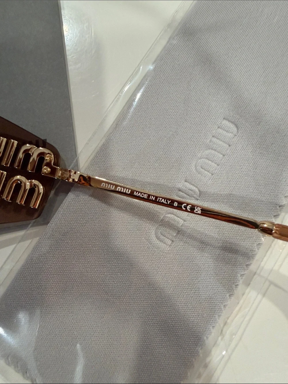Miu Miu Brown Rimless Sunglasses with Gold Bridge